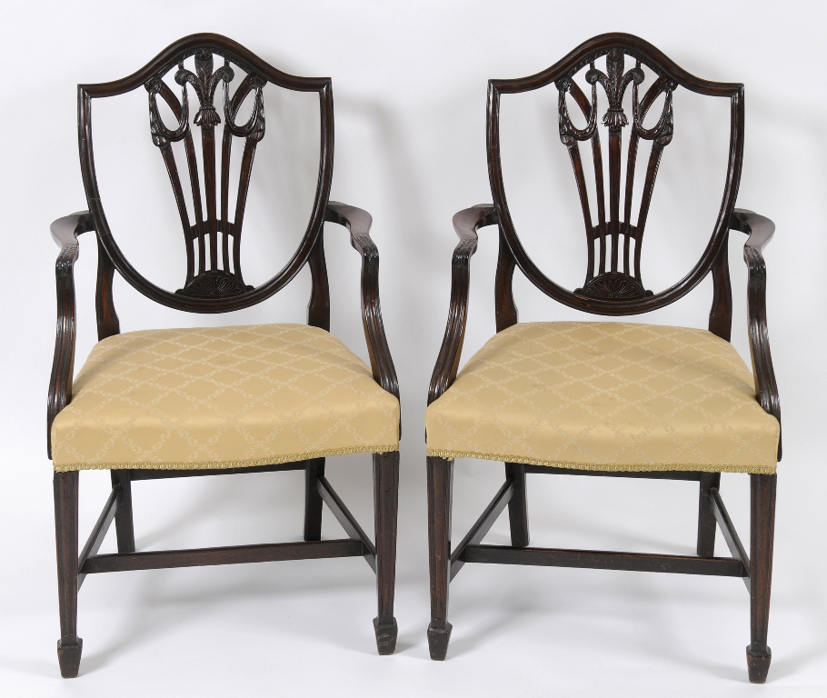 A set of eight George III style mahogany dining chairs, with shield shaped splat backs (6+2) (8)