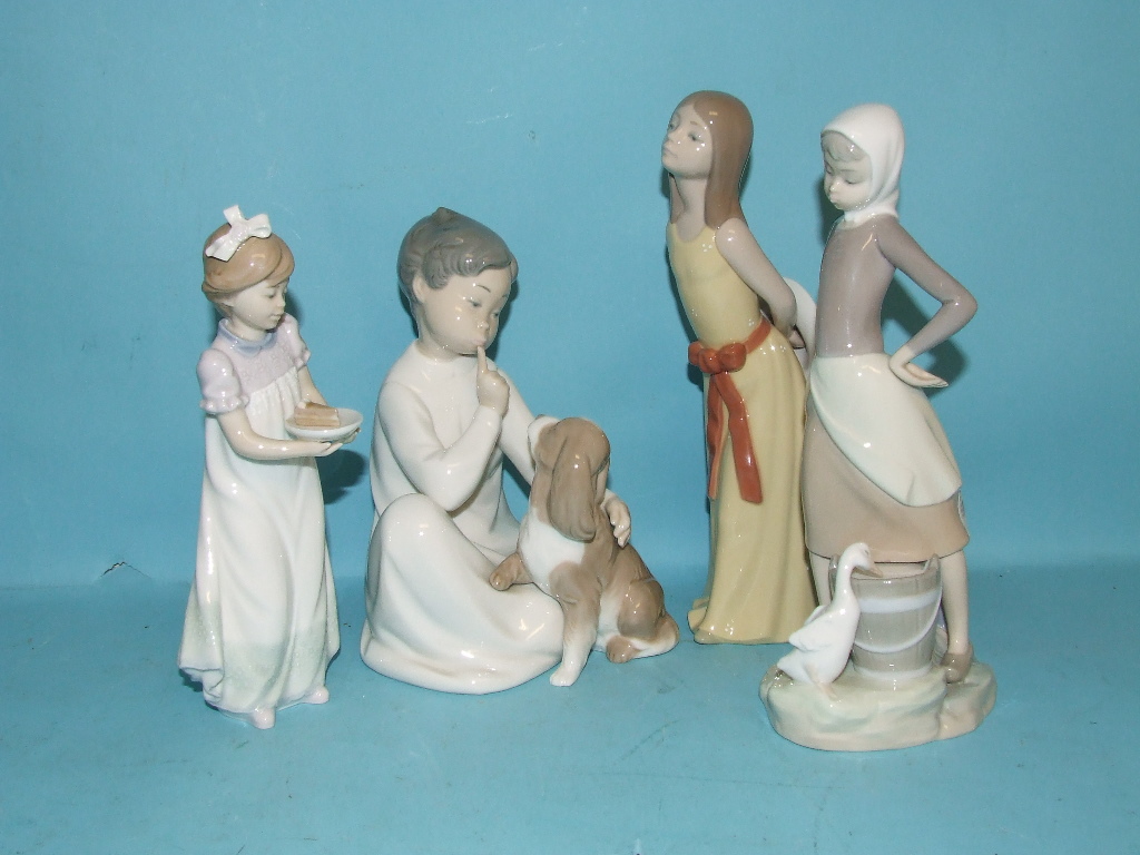 A Lladro figure, of a girl carrying a piece of cake, three other Lladro figures, glass and two Royal