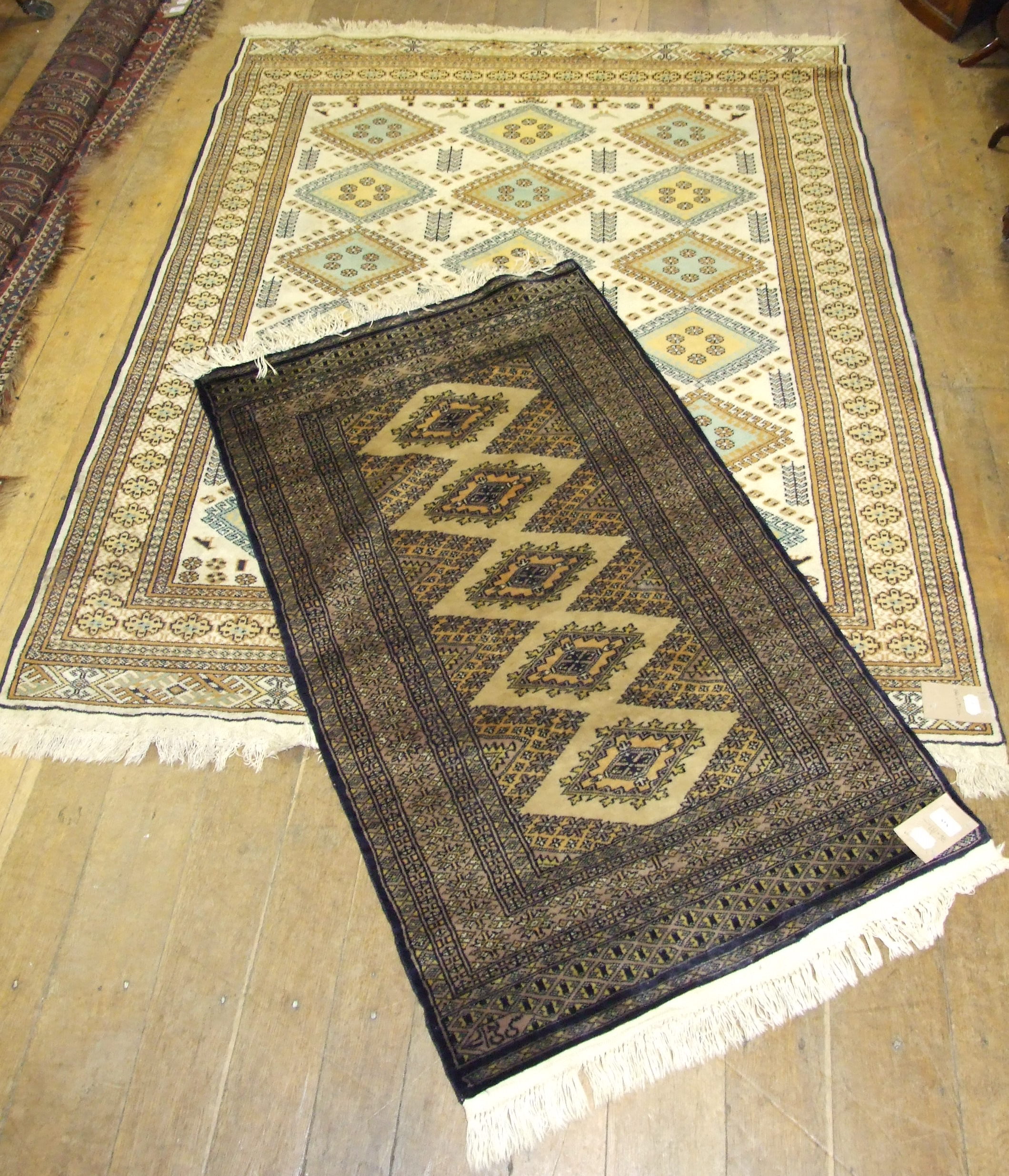 An Eastern rug, 144 x 190 cm, and another smaller (2)