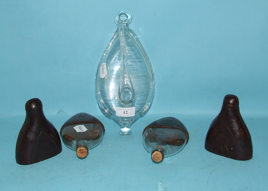 A glass barometer, 25 cm high, and two glass flasks, with leather cases (3)