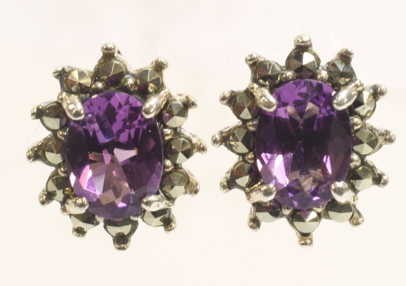 -Click here to bid -   Pair of Amethyst and Marcasite stud earrings (est. £20-£40)