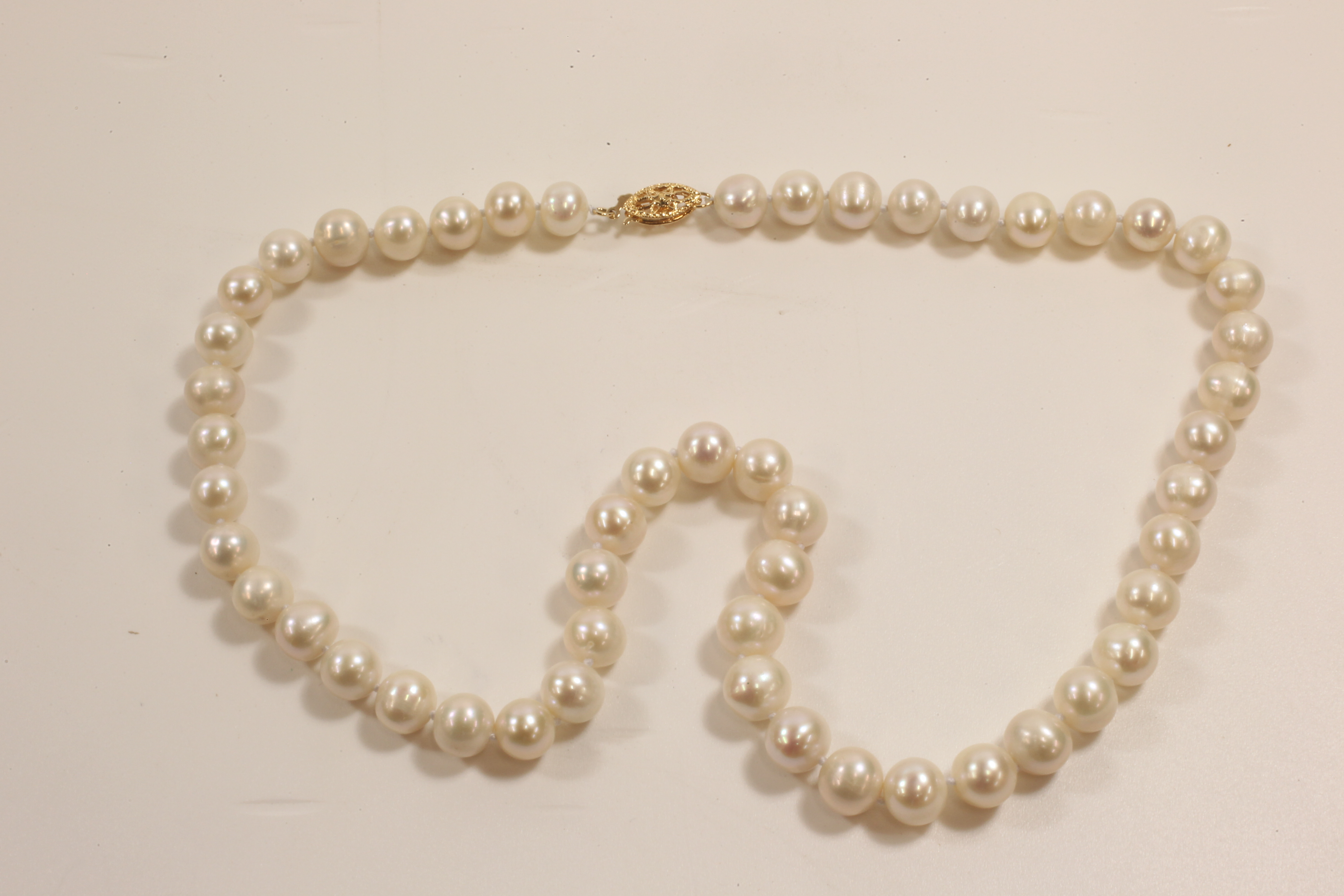 -Click here to bid -   Cultured Pearl necklace (each 7-8mm) with 14k Gold clasp. Length 44cm