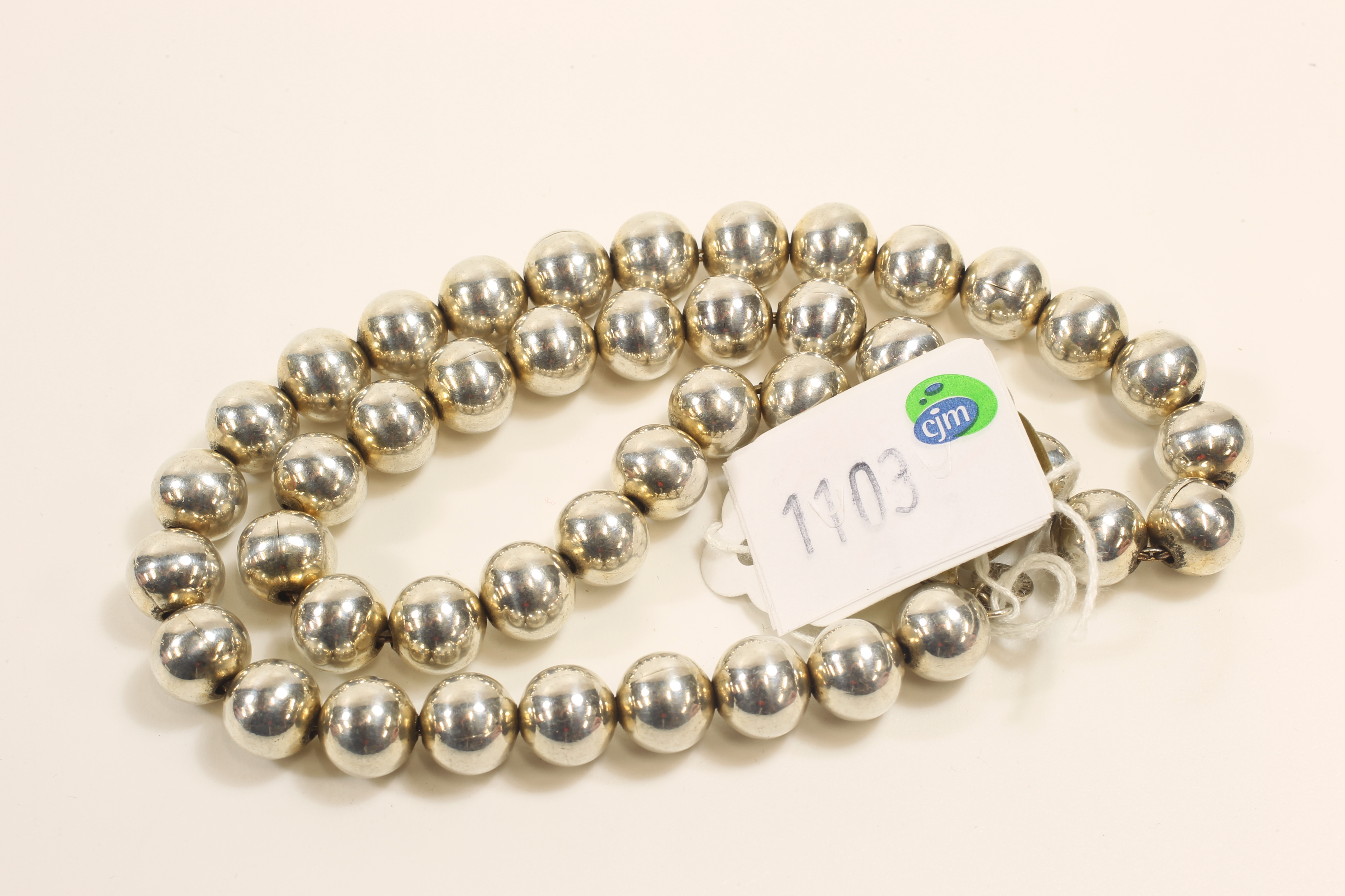 -Click here to bid -   A Tiffany style Silvered bead necklace. (est. £60-£80)