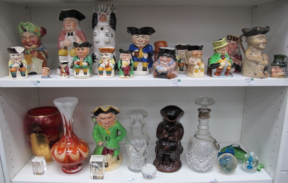 -Click here to bid -   * Four shelves of Toby Jugs, large and small together with ornamental clear