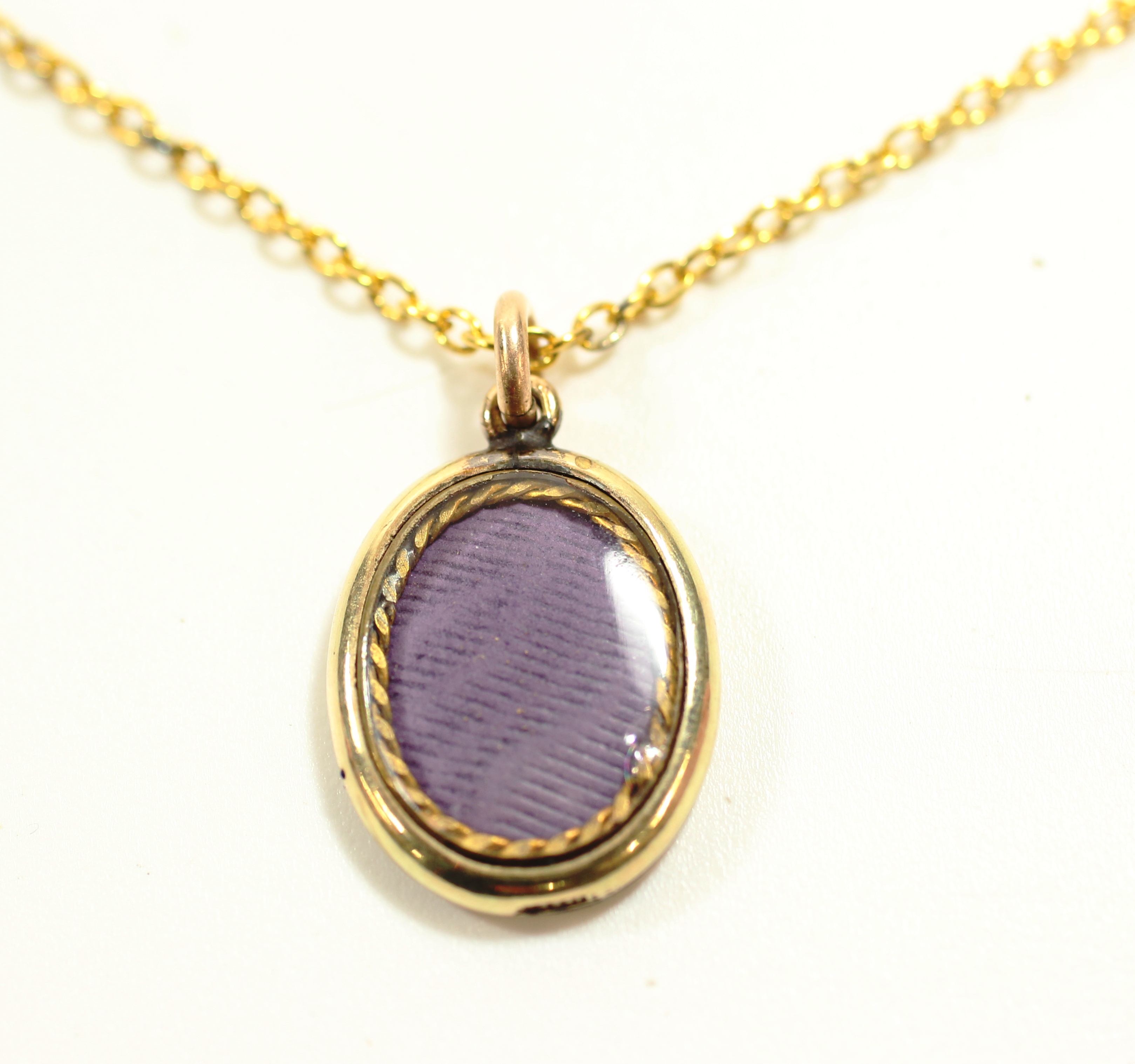 -Click here to bid -   Antique (Edwardian) blue enamelled locket on 46cm chain (est. £20-£40)