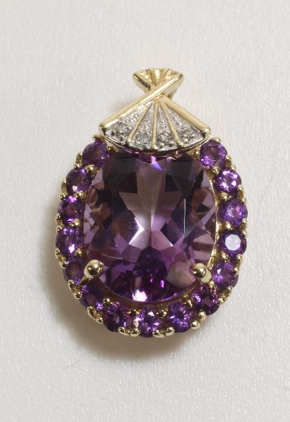 -Click here to bid -   Amethyst and Diamond pendant (tests as 9ct) (est. £60-£80)