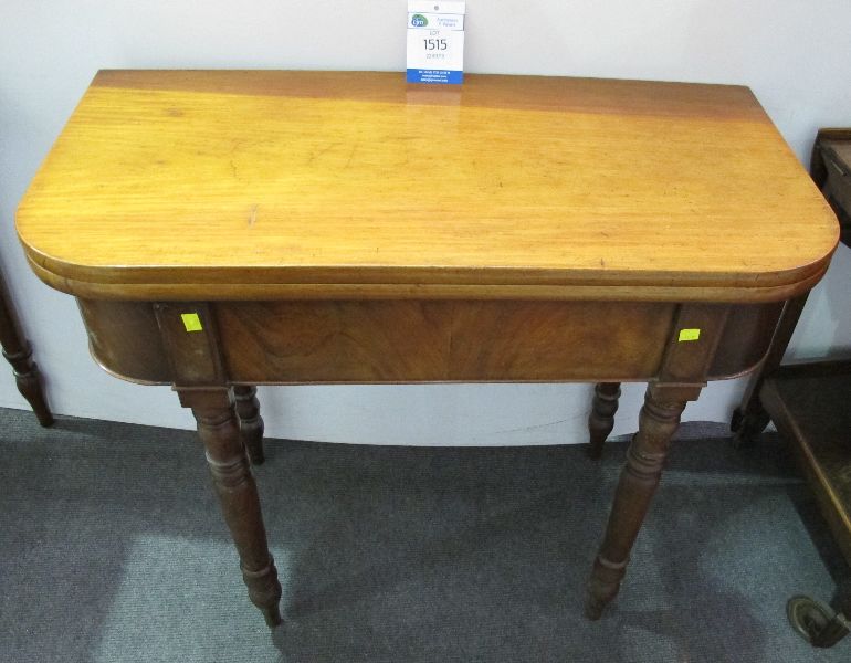 19TH CENTURY MAHOGANY FOLD OVER TEA TABLE ON TURNED LEGSBidding is taking place on our sister site