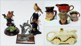 Two Doulton character jugs, another, three bird models, car teapot and Carlton Ware Brown and Polson