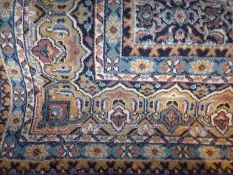 Large Persian style wool rug, cream ground with yellow and green borders with central rectangle with