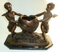 Bronze effect metal and marble centrepiece having two cherubs flanking bowls supported on marble