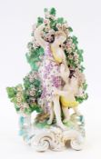 Eighteenth-century Chelsea Derby porcelain group of Venus and Cupid, Cupid reaching for flowers from