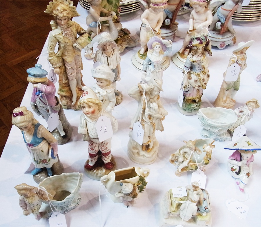 Ten tinted bisque and other porcelain German style figures, similar posy holder, fairing and