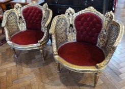 Pair reproduction giltwood red upholstered tub chairs, foliate carved with padded back and seat,