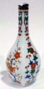 Japanese  bottle vase, bulbous and square section, decorated in Kakiemon style with flowering