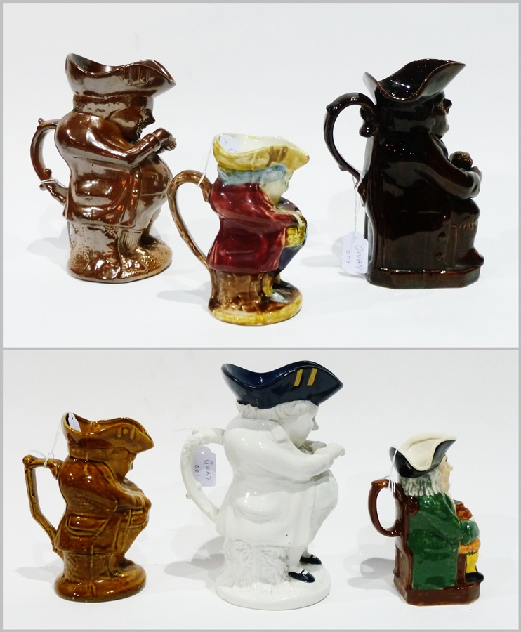 19th century earthenware treacle glazed Toby jug and a 19th century stoneware Toby jug, with four