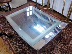 Modern metal concave coffee table, with glass rectangular top to concave under-tier, on tapering