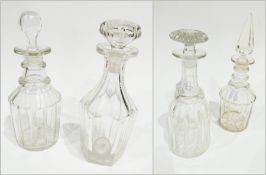 Four various cut glass wine decanters and stoppers