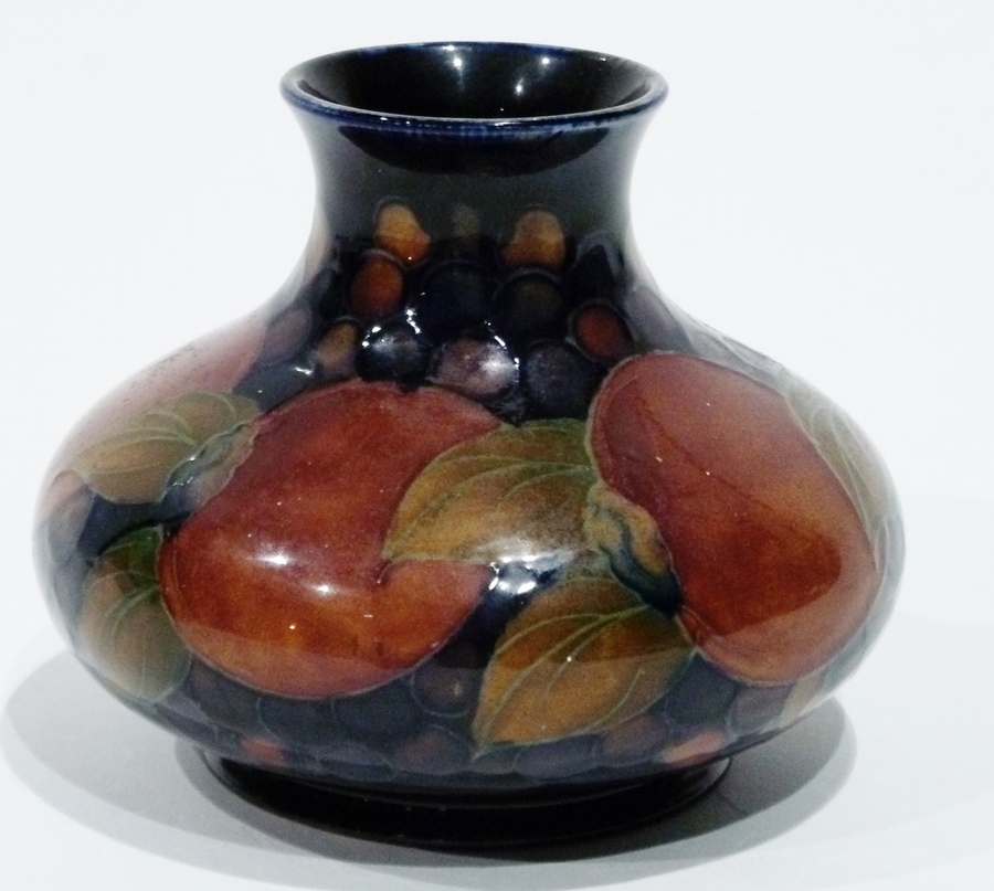 Moorcroft 'Pomegranate' pattern vase, squat baluster shape,11.5 cms high
