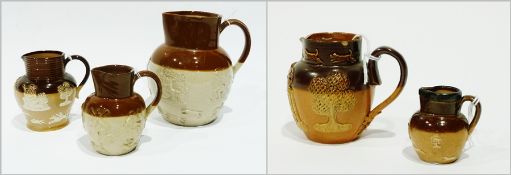 A collection of Doulton Lambeth pottery harvest jugs, various sizes, (5)