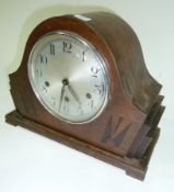 Mid twentieth century oak mantel clock with chiming and striking movement, in broken arch case