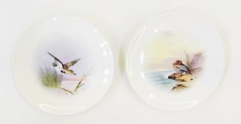 Two Tiffany and Co Mintons china plates, each painted with bird by J.E. Dean signed, 22 cm diameter