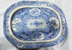 19th century blue and white pottery meatplate, decorated with panels of pagodas, floral ground and