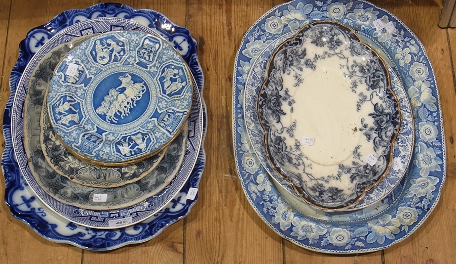 Large Victorian blue and white pottery meatplate, decorated with figures in punt within landscape