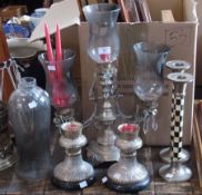 A pair of silver plated candlesticks with black and white chequered decoration to column, three