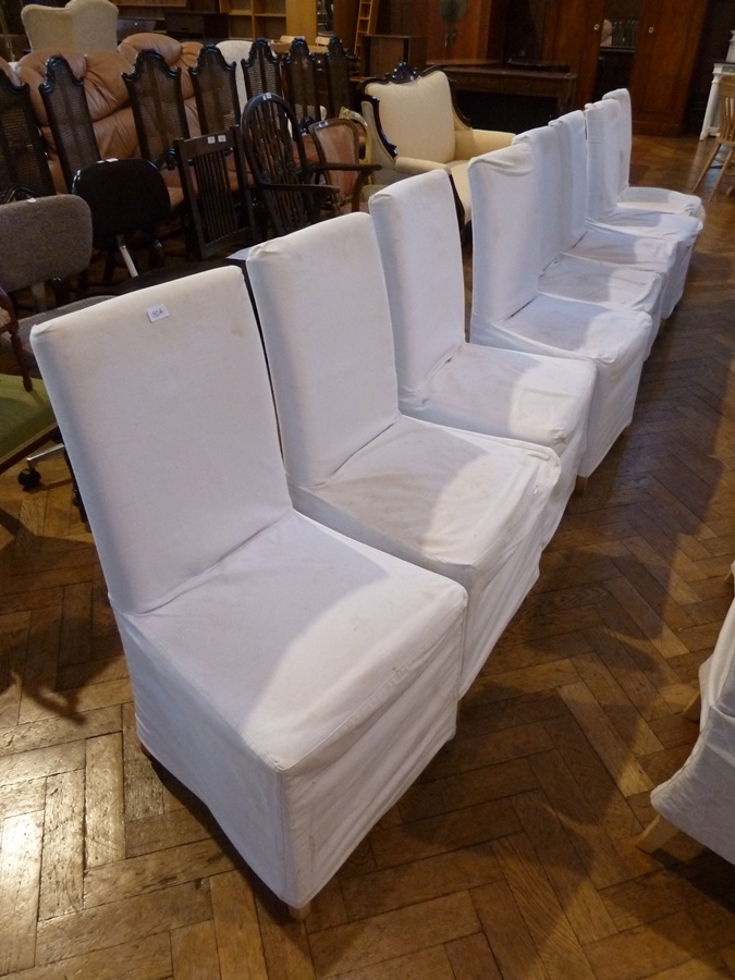 Set of eight modern square backed dining chairs, with loose covers, padded seat on straight