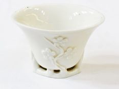 Eighteenth century Chinese Fuchien blanc de chine libation cup, with branch foot trailing prunus