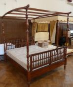 Twentieth century dark wood four poster bed, carved slatted top on turned supports with pierced