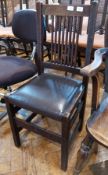 Gustav Stickeley oak chair, slatback with leather seat, on straight supports, with label to back