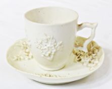 Eighteenth-century (c. 1750) 'blanc de chine' Bow porcelain cup and saucer, the cup with