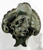 Four ornate relief-carved theatrical mask plaques in the style of "Commedia dell'arte", pair leaf