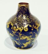 A Royal Doulton porcelain ovoid-shaped vase, with deep blue glaze, overlaid with foliate giltwork