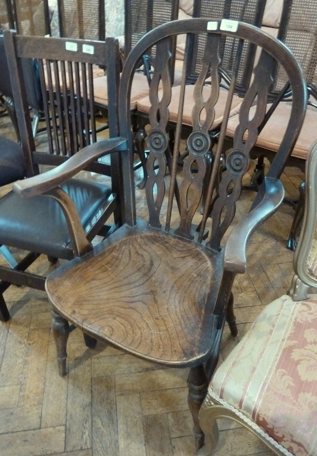 20th century oak Windsor style open armchair, on turned supports