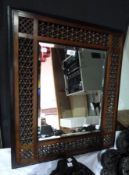 Carved and pierced Moorish style mirror with bobbin turned fretwork borders