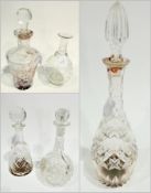 Cut glass wine decanter, mallet shaped, another shouldered and tapering and three others various (5)