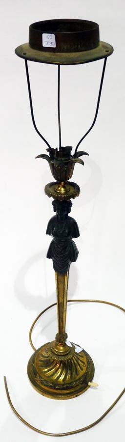 Gilt metal table lamp with pointed foliate sconce, caryatid column on circular wrythen base