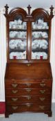 Late eighteenth century oak bureau bookcase, a cabinet upper section with double domed top and three