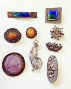 Arts and Crafts pewter brooch, set with purple glazed Ruskin pottery panel, circular, another,