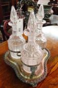 Silver plate condiment stand, with three cut glass decanters, (rims slightly af)