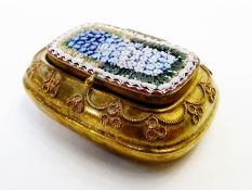 Small gold-coloured trinket box, decorated with leaf, floral basket and motifs around the side,