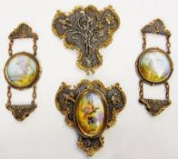 Pierced white and gilt metal buckle, floral and scroll decorated with hand painted porcelain