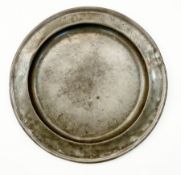 Late eighteenth century German single reed and wrigglework- decorated pewter dish, 43cm diameter