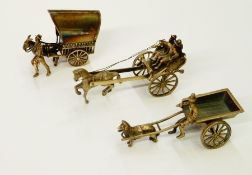 Dutch silver-coloured metal miniature model of a man on dog cart and two other miniature models (3)