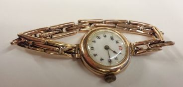 Lady's 9ct gold wristwatch, possibly 1930's, circular enamel dial, Arabic numerals, button