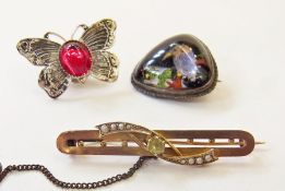 Gold-coloured metal bar brooch, silver butterfly wing brooch, decorated with bird, and another