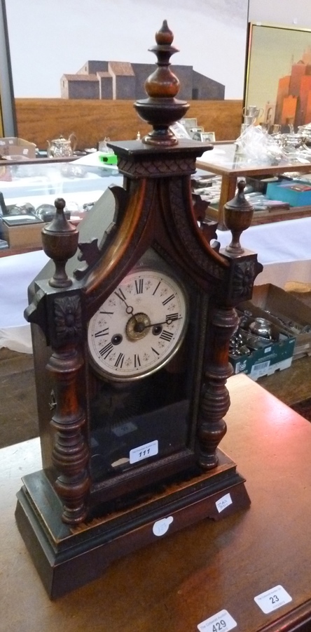 A Edwardian mahogany mantel clock, with triangular arch