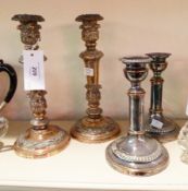 Pair silver plate candlesticks, with foliate relief decoration, and pair smaller silver plate